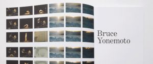 Open book displaying a grid of film stills on the left page and the name "Bruce Yonemoto" in large text on the right page.