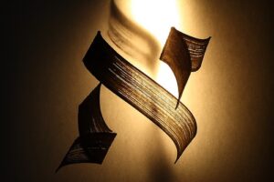 Sheets of paper caught in a whirl, seemingly dancing in the warm glow of a light.