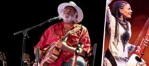 Taj Mahal singing with head held upwards and Sona Jobarteh holding an instrument in one arm and other arm in air.