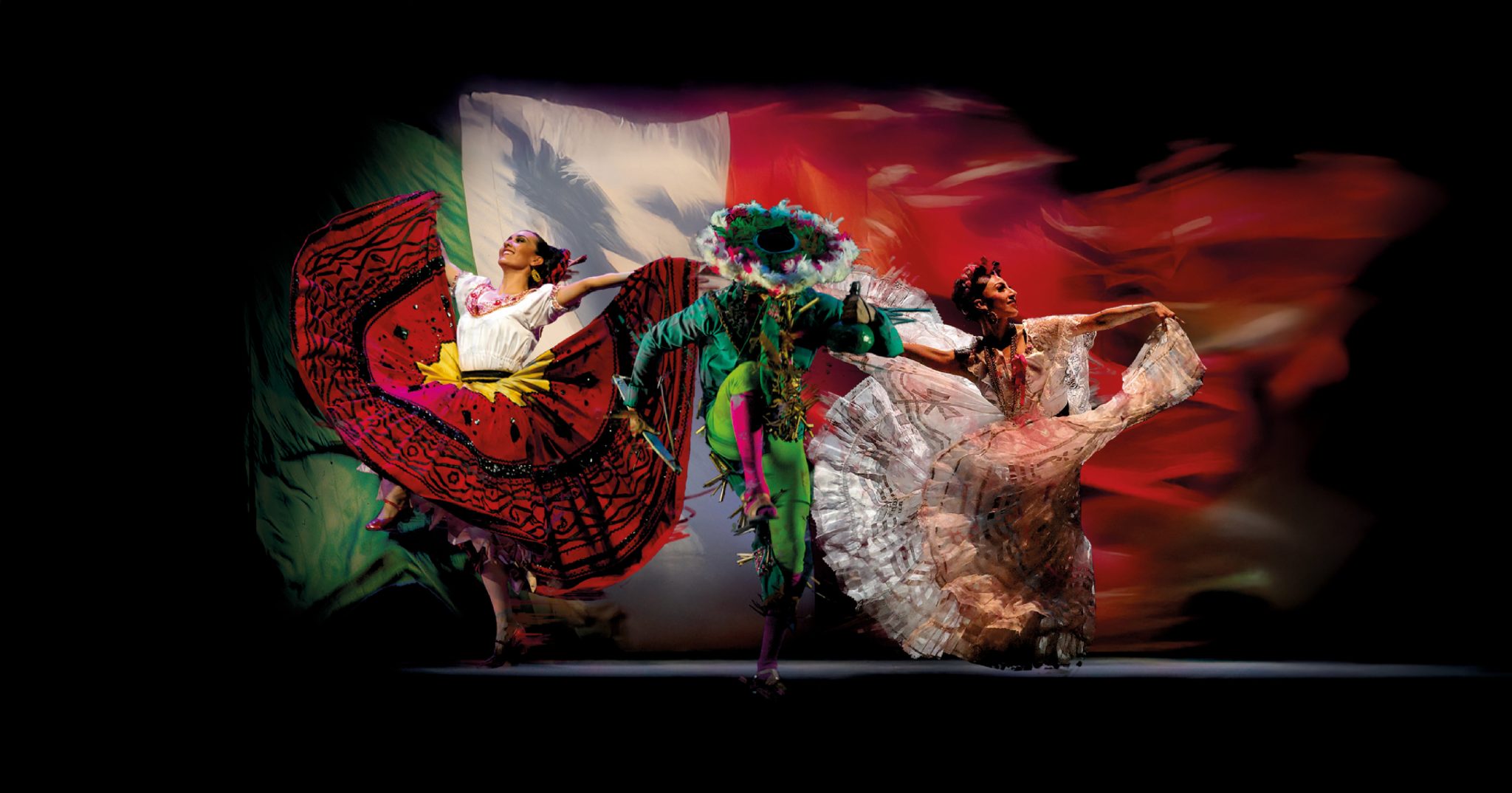 Traditional Mexican dancers in colorful costumes in front of a stylized Mexican fkag backdrop