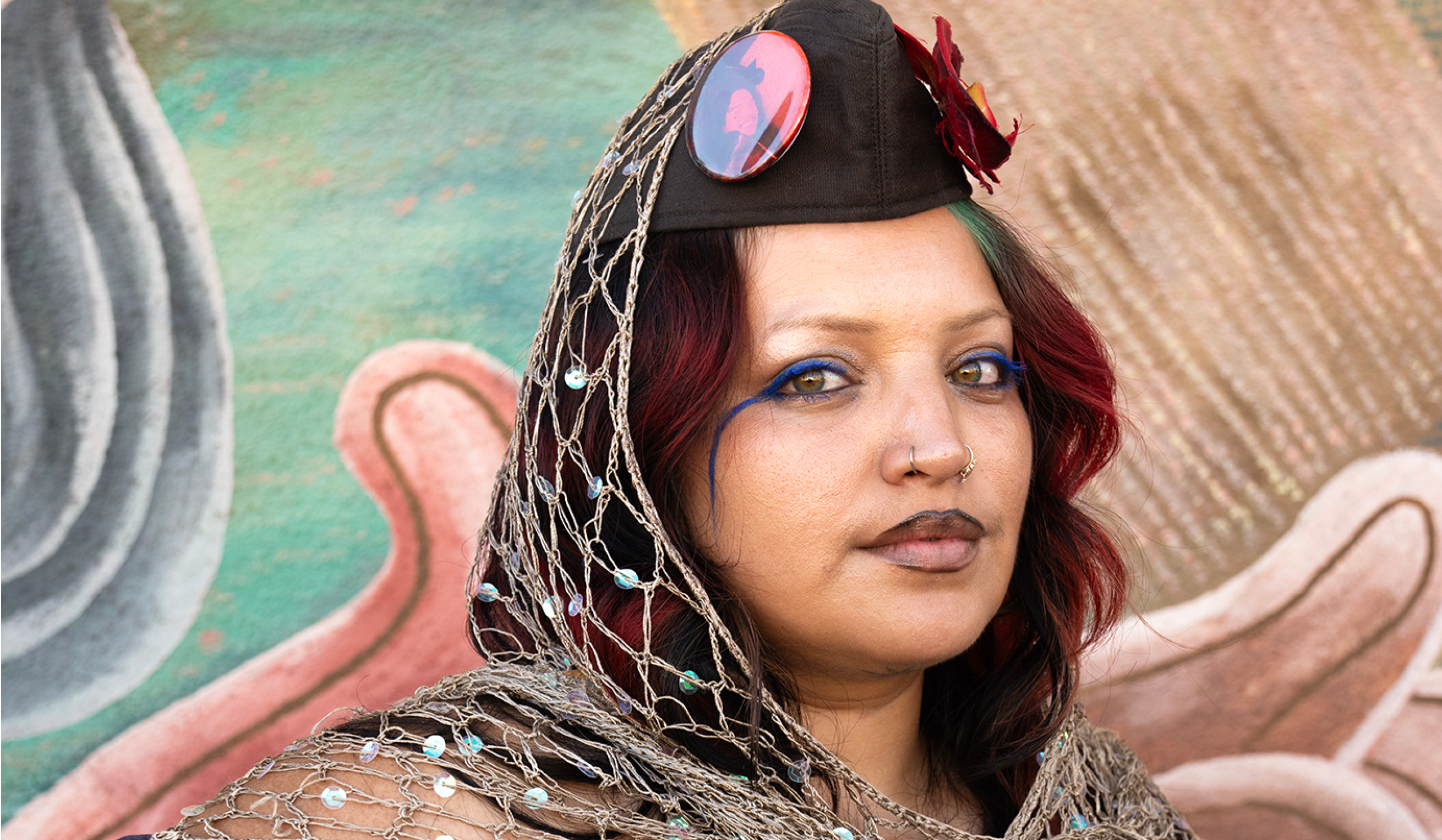 Portrait of artist Amina Cruz posing for the camera.