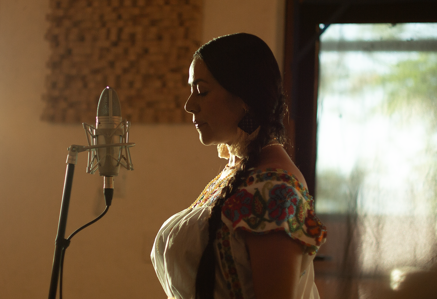 Three flamenco musicians perform on stage in Madrid